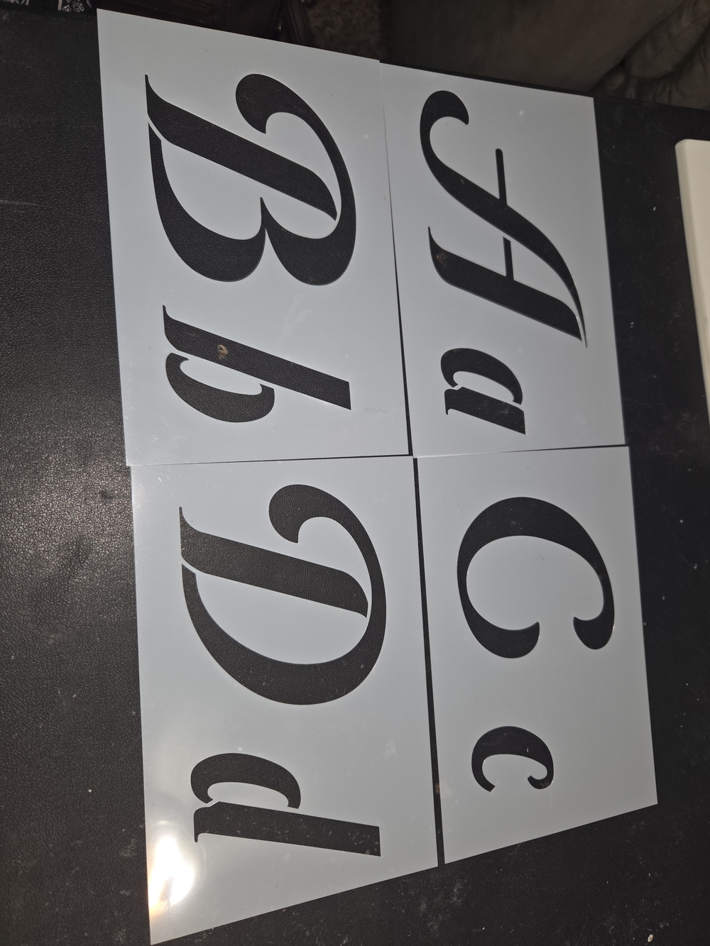 Black Script Letter Stencil Set on White Panels